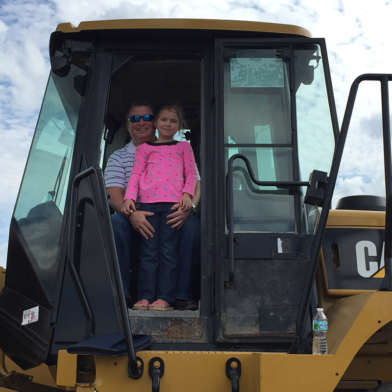 Mark Madigan and Daughter in Wheel Loader